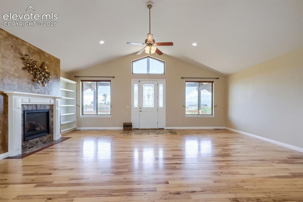 Image 6 of 47: The Greatroom features a gas fireplace and views of Pikes Peak. The followi