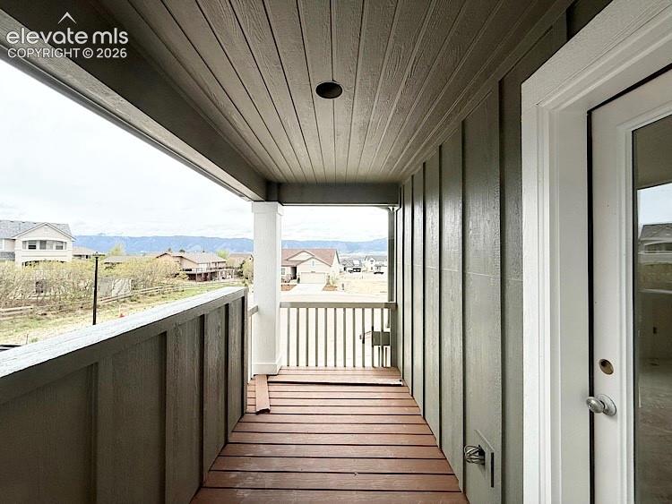 Image 13 of 38: Covered Balcony Deck