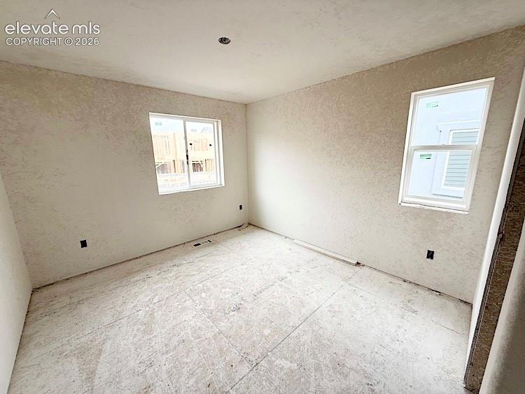 Image 16 of 38: Bedroom 2 located on the Upper Level