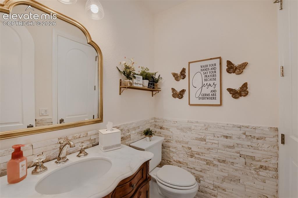 Image 30 of 50: 1/2 bath on main level for guests