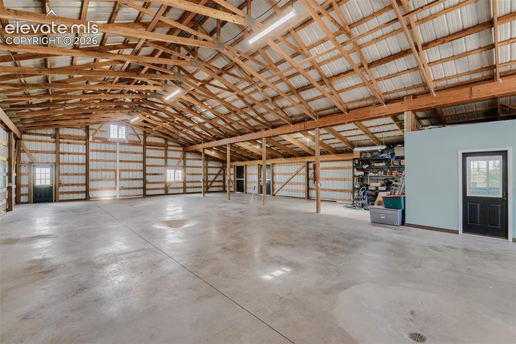 Image 47 of 50: What a workspace/storage or Biggest RV plus additional finished storage roo