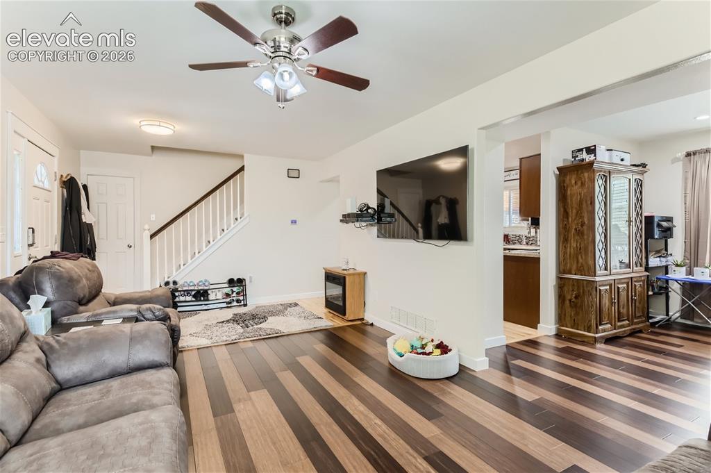 Image 5 of 49: Wood-finish flooring with varied tones