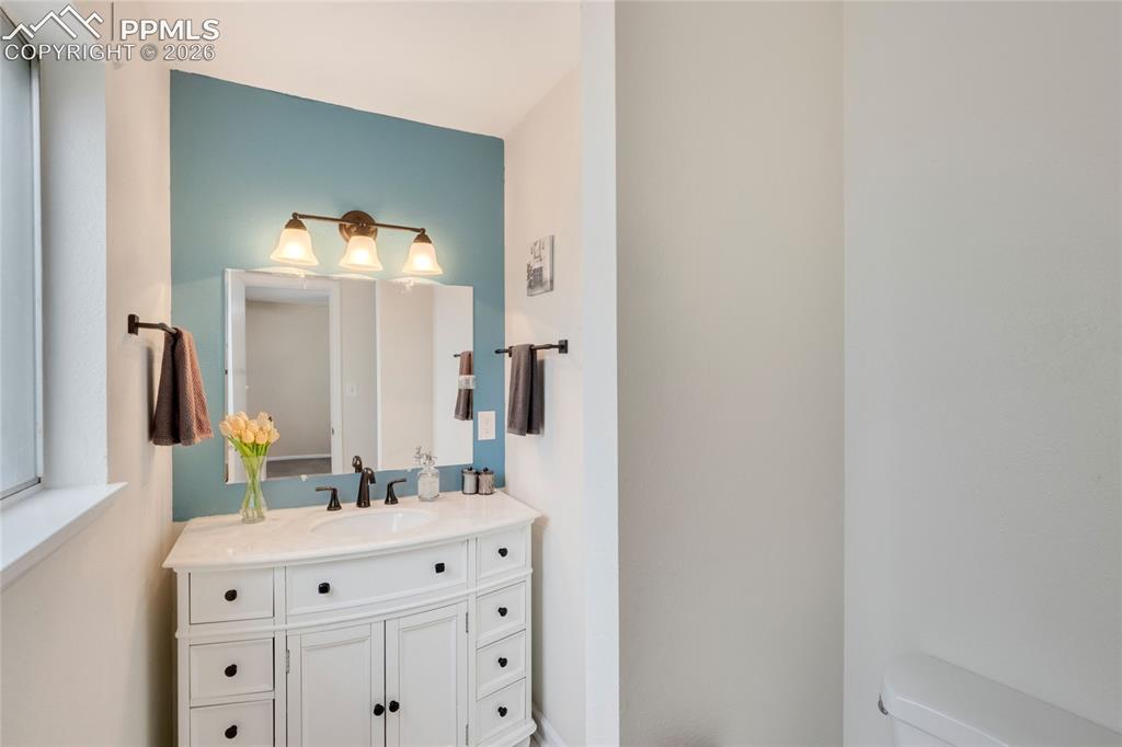 Image 12 of 31: Primary Bedroom with in-suite half bath