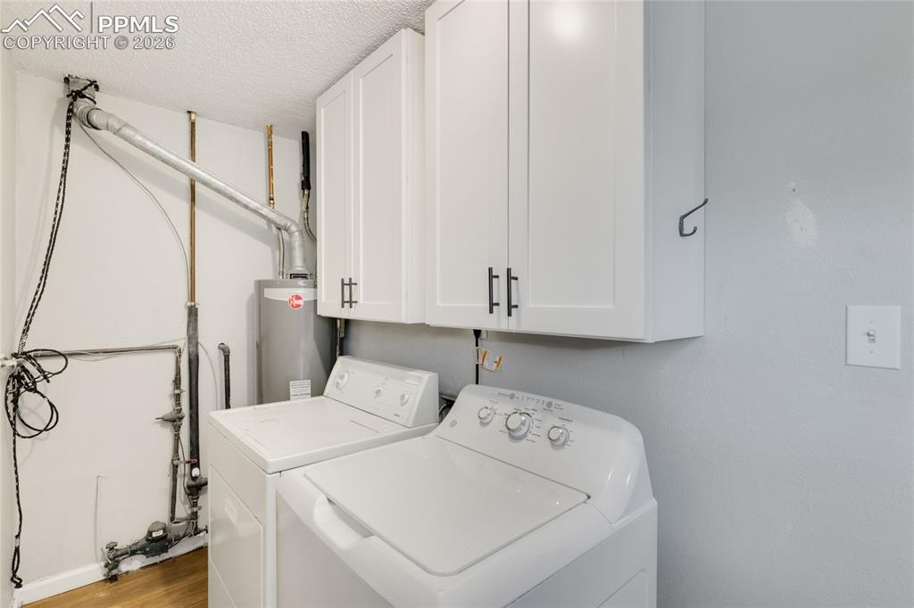 Image 23 of 31: Lower level laundry area