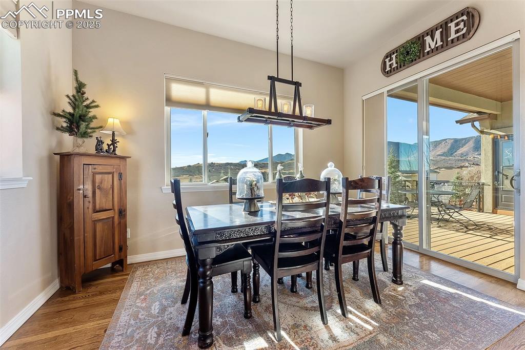 Image 14 of 50: Dining room attached to kitchen with hardwood floors, natural light, walk-o