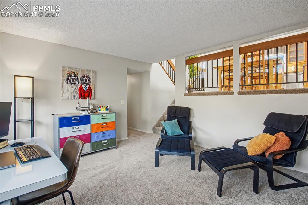 Image 19 of 42: Family room with view into dining area