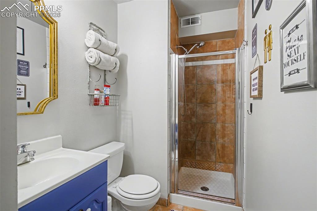 Image 23 of 42: Bright primary bathroom with enclosed shower
