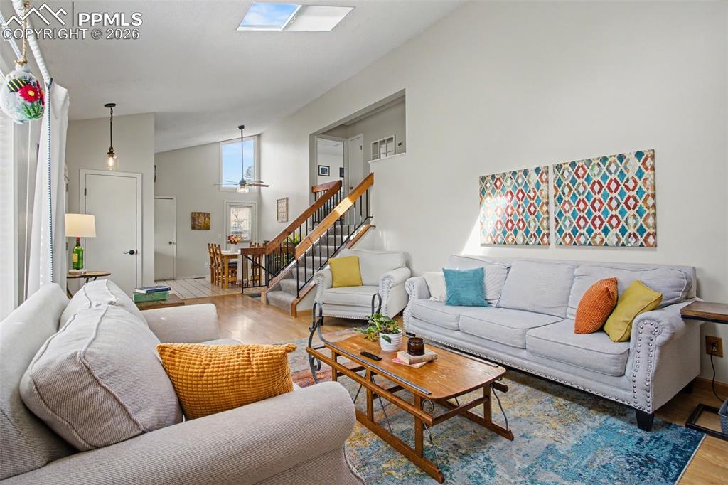 Image 9 of 42: Living room with view into dining area