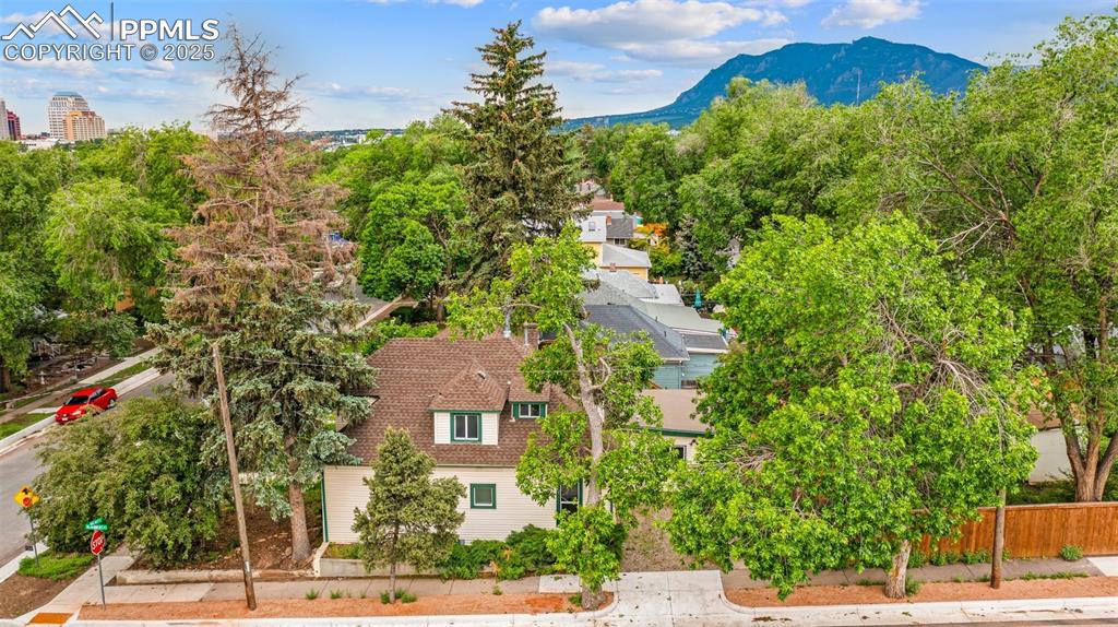 Image 10 of 48: Scenic neighborhood view with mountain backdrop.