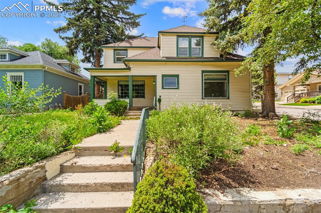 Image 12 of 48: Crisp view of the front entry and landscaping.