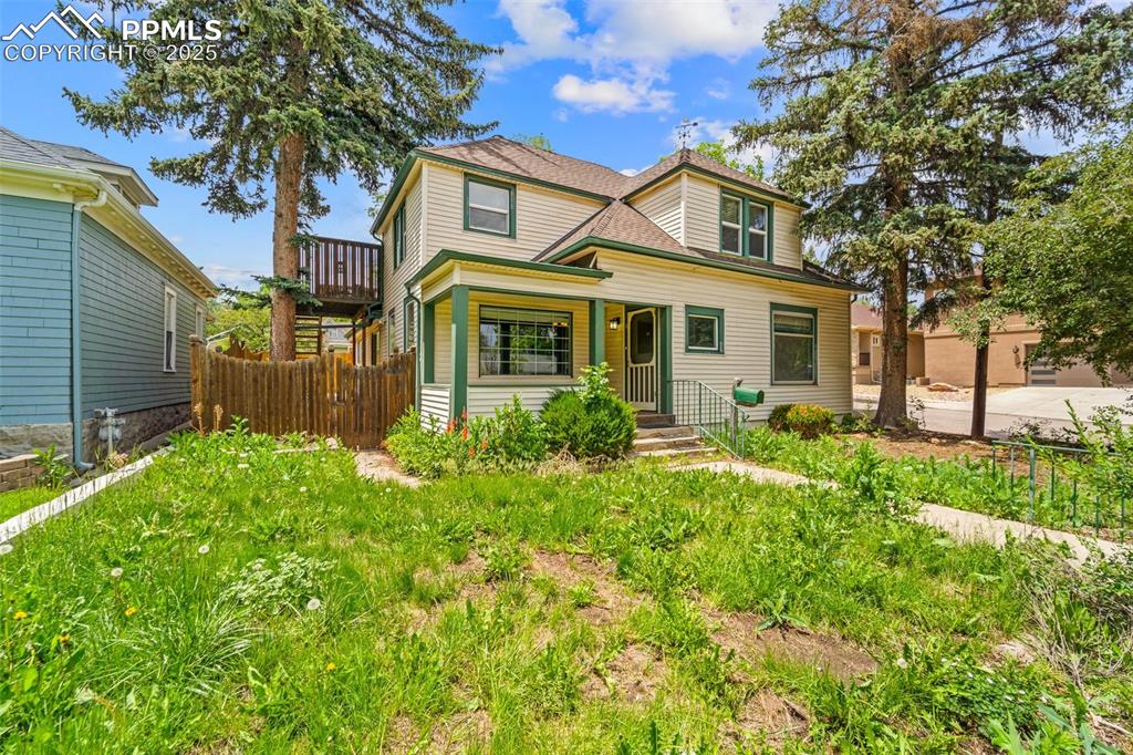Image 13 of 48: Well-maintained exterior with lawn and walkway.