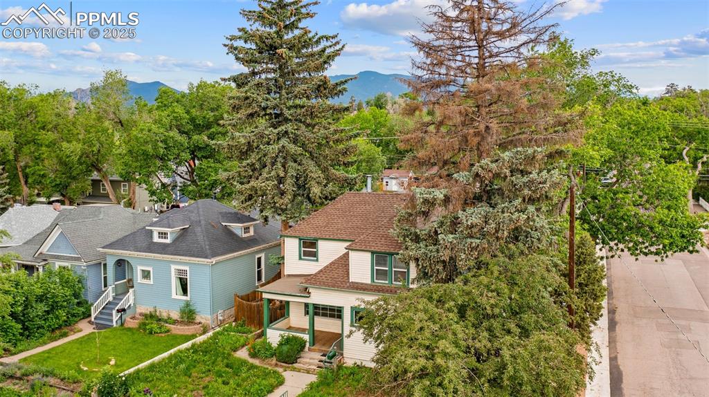 Image 2 of 48: Aerial view showcasing the property nestled in a lush, wooded area.
