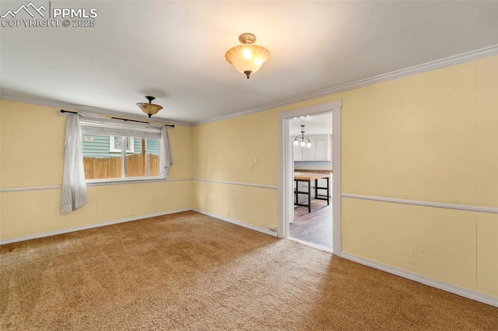 Image 26 of 48: Versatile flex space adjacent to the kitchen.