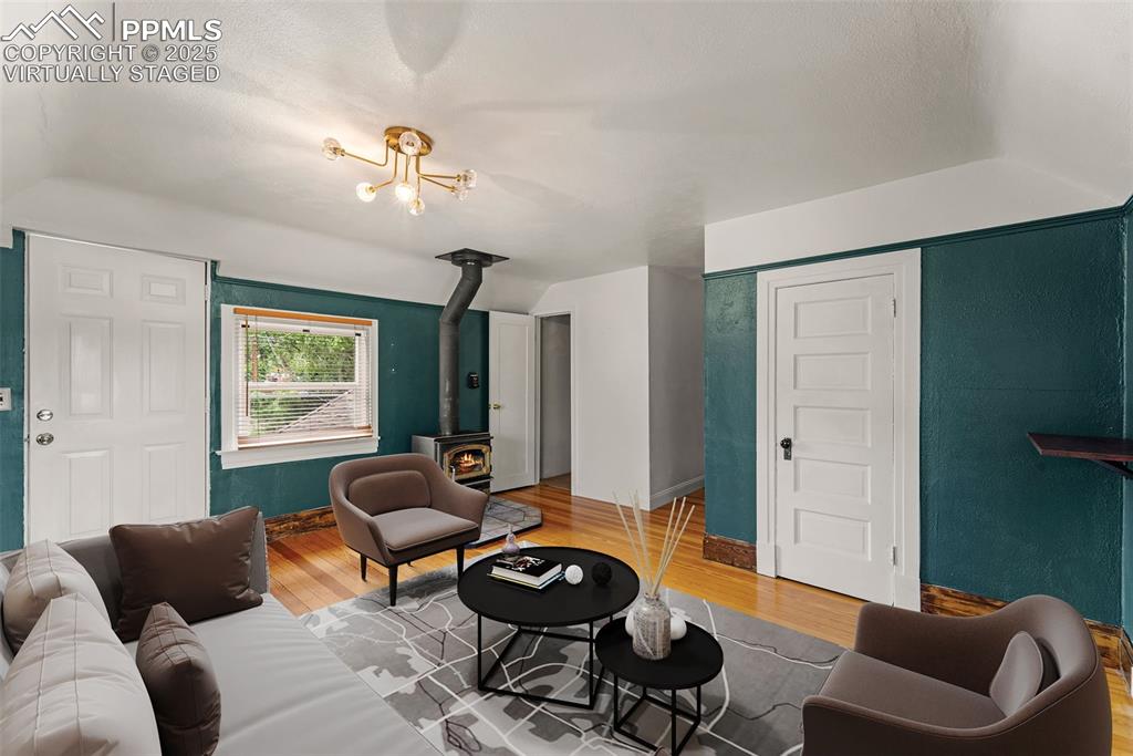 Image 33 of 48: Virtually Staged / Living area with hardwood floors and abundant light.