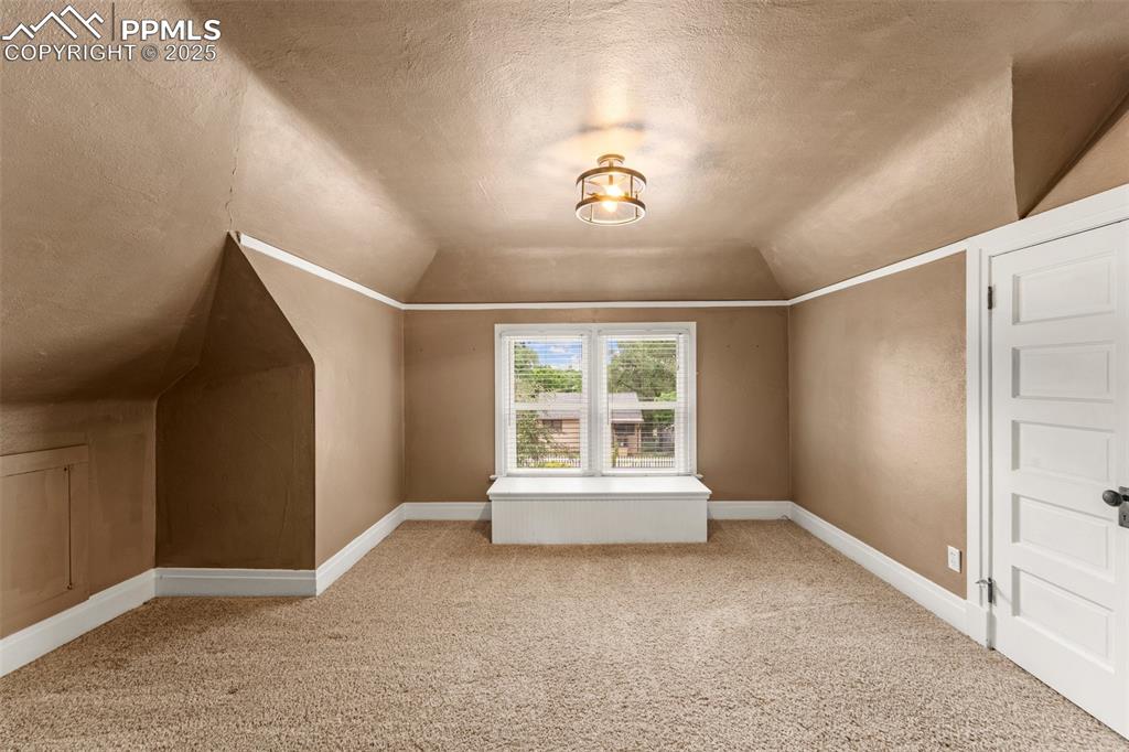 Image 37 of 48: Bonus room ideal for home office or guest room.