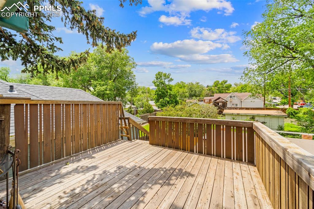 Image 41 of 48: Deck space overlooking the backyard.