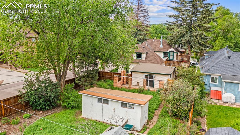 Image 9 of 48: Aerial view of the home and adjacent properties.