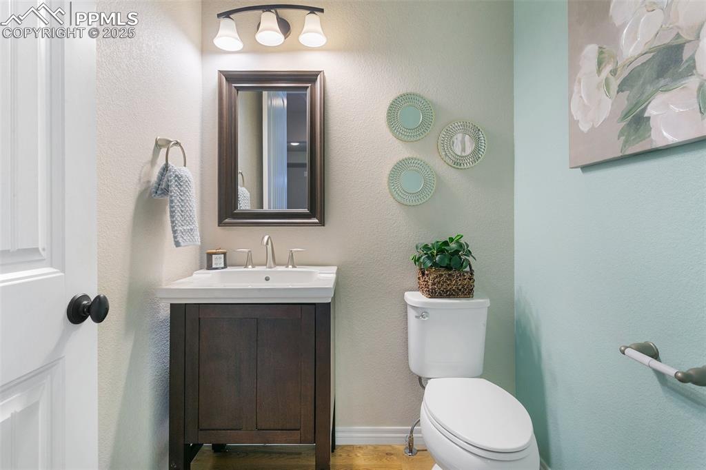 Image 15 of 41: Bathroom featuring vanity and wood finished floors