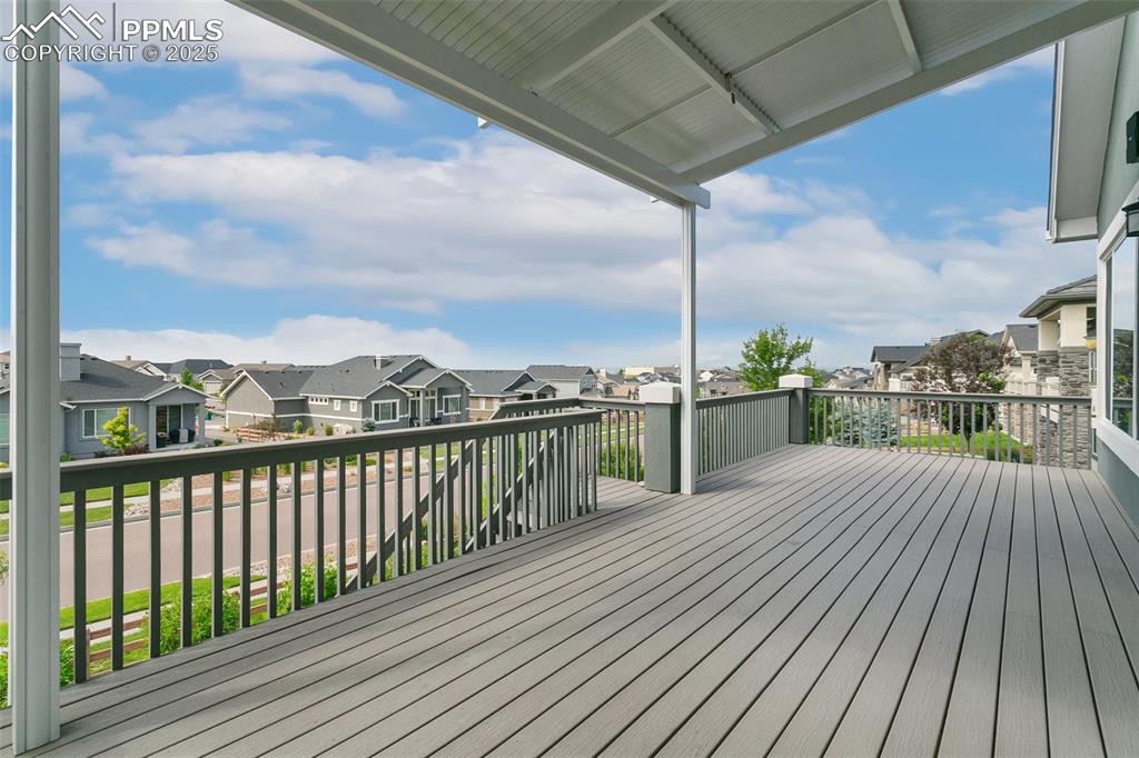 Image 31 of 41: Wooden terrace with a residential view
