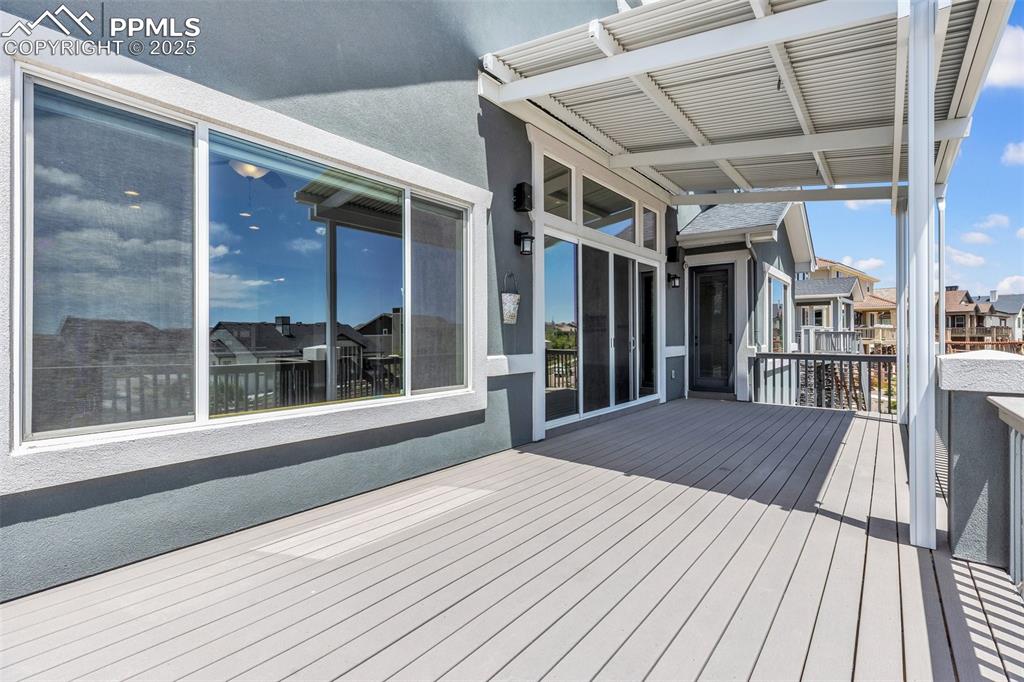 Image 32 of 41: Wooden terrace with a residential view