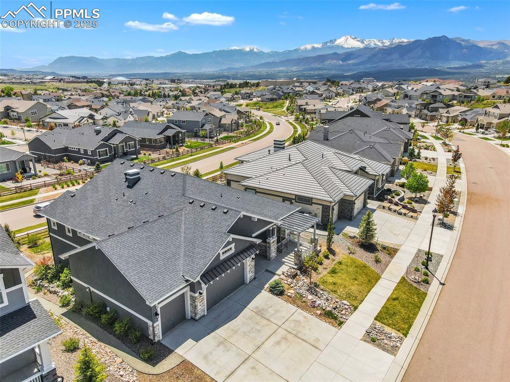 Image 4 of 41: Aerial perspective of suburban area with a mountain backdrop