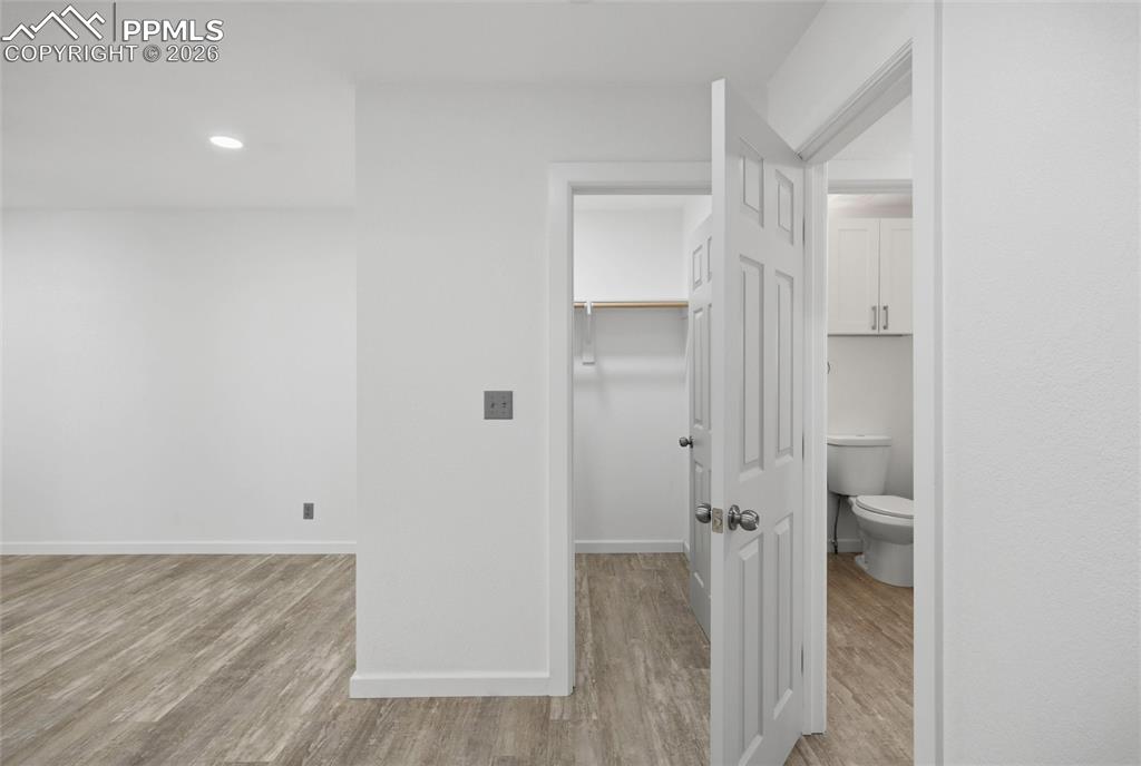 Image 15 of 37: View into walk-iin closet & hall