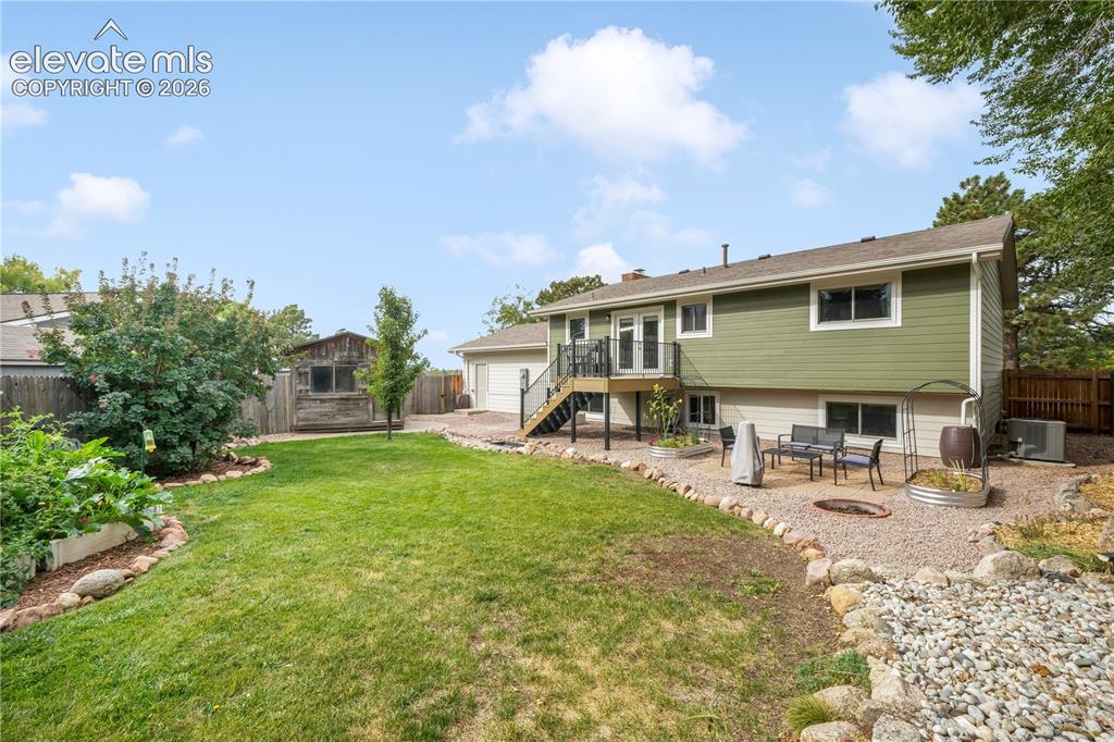 Image 38 of 50: Back yard with entertaining areas, shed, landscaped, garden areas and priva