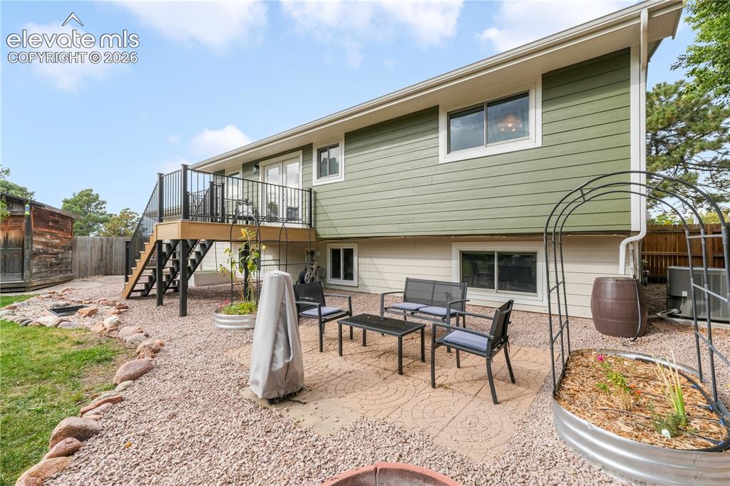 Image 39 of 50: Back yard with entertaining areas, shed, landscaped, garden areas and priva