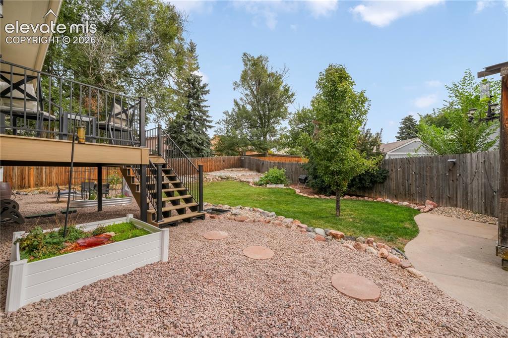 Image 41 of 50: Back yard with entertaining areas, shed, landscaped, garden areas and priva