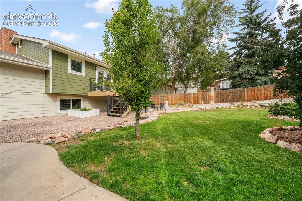 Image 42 of 50: Back yard with entertaining areas, shed, landscaped, garden areas and priva