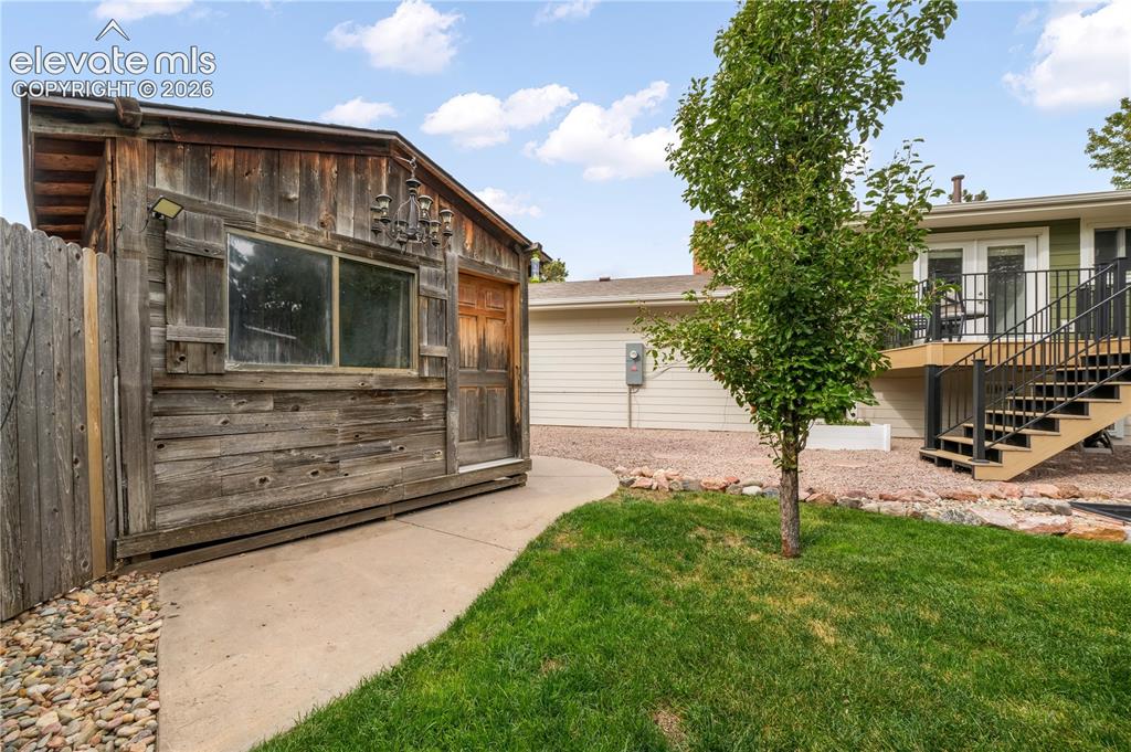 Image 44 of 50: Back yard with entertaining areas, shed, landscaped, garden areas and priva