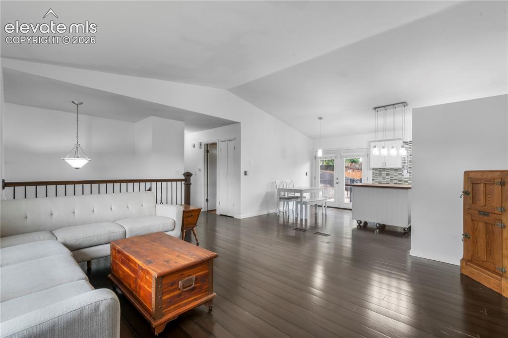 Image 8 of 50: Upper living room with views into kitchen