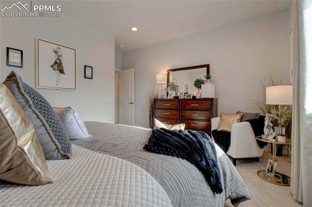 Image 30 of 30: Bedroom with carpet floors and recessed lighting