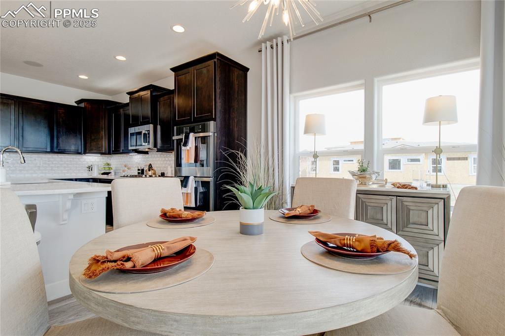 Image 9 of 30: Dining room featuring recessed lighting