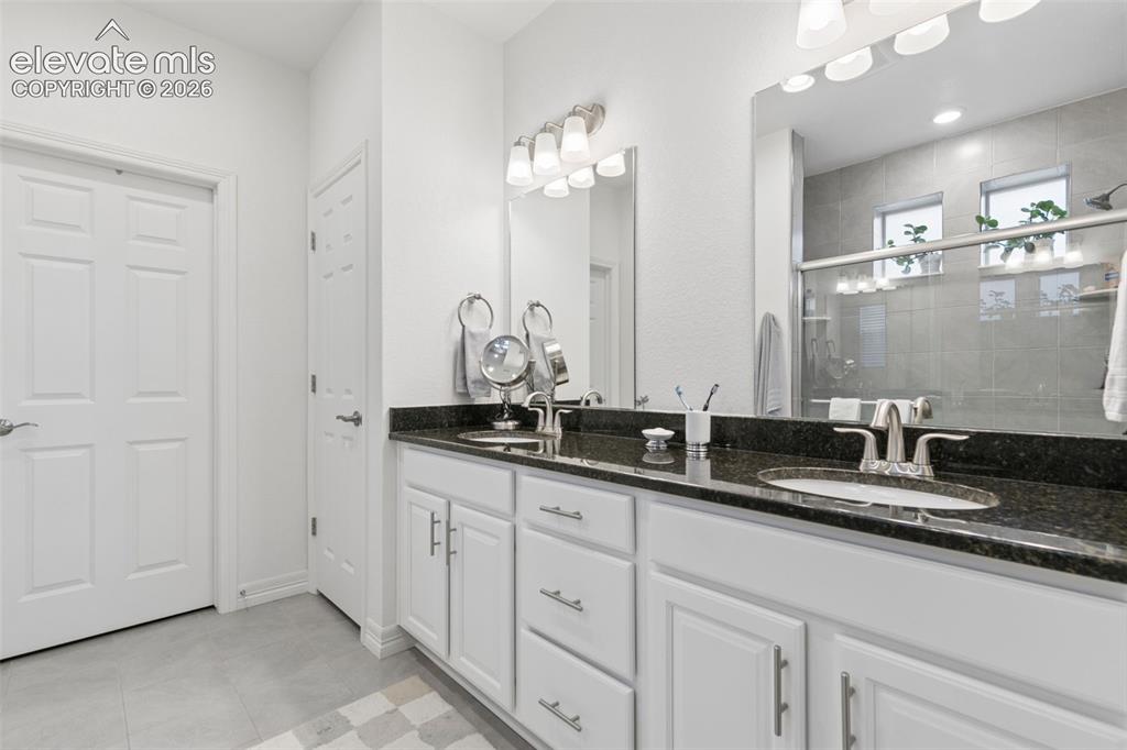 Image 26 of 34: Master Bathroom with 36