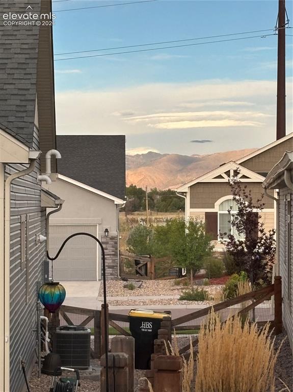Image 3 of 34: View 1 of Mountains from the front door thru the back of the house