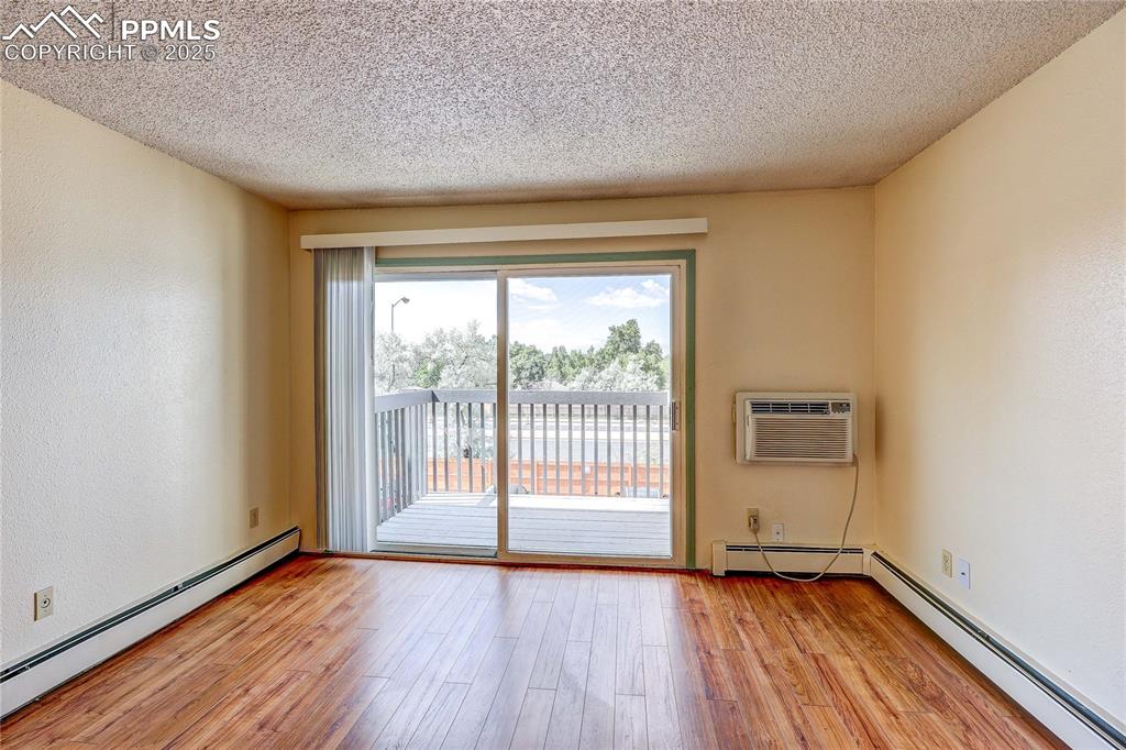 Image 15 of 20: Another view of the living room facing the deck.