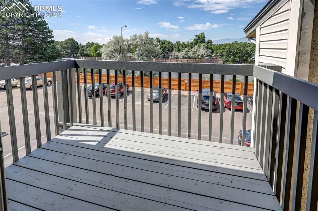 Image 20 of 20: Deck featuring view of trees and Pikes Peak