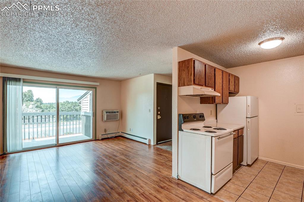 Image 5 of 20: Kitchen and living room from dining room.