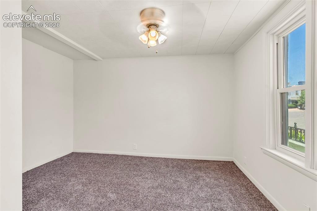 Image 14 of 29: Room featuring neutral-toned walls, textured ceiling, and a ceiling-mounted