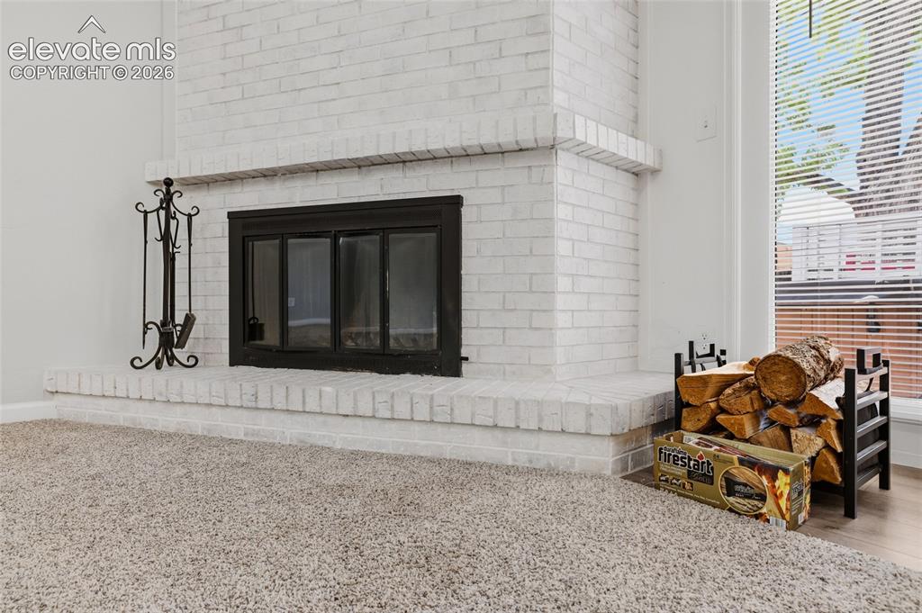 Image 17 of 43: Wood burning fireplace