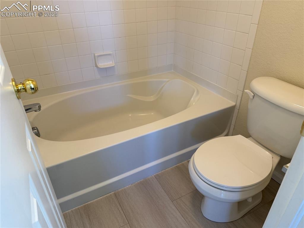 Image 15 of 32: Full bath featuring toilet and shower / bath combination
