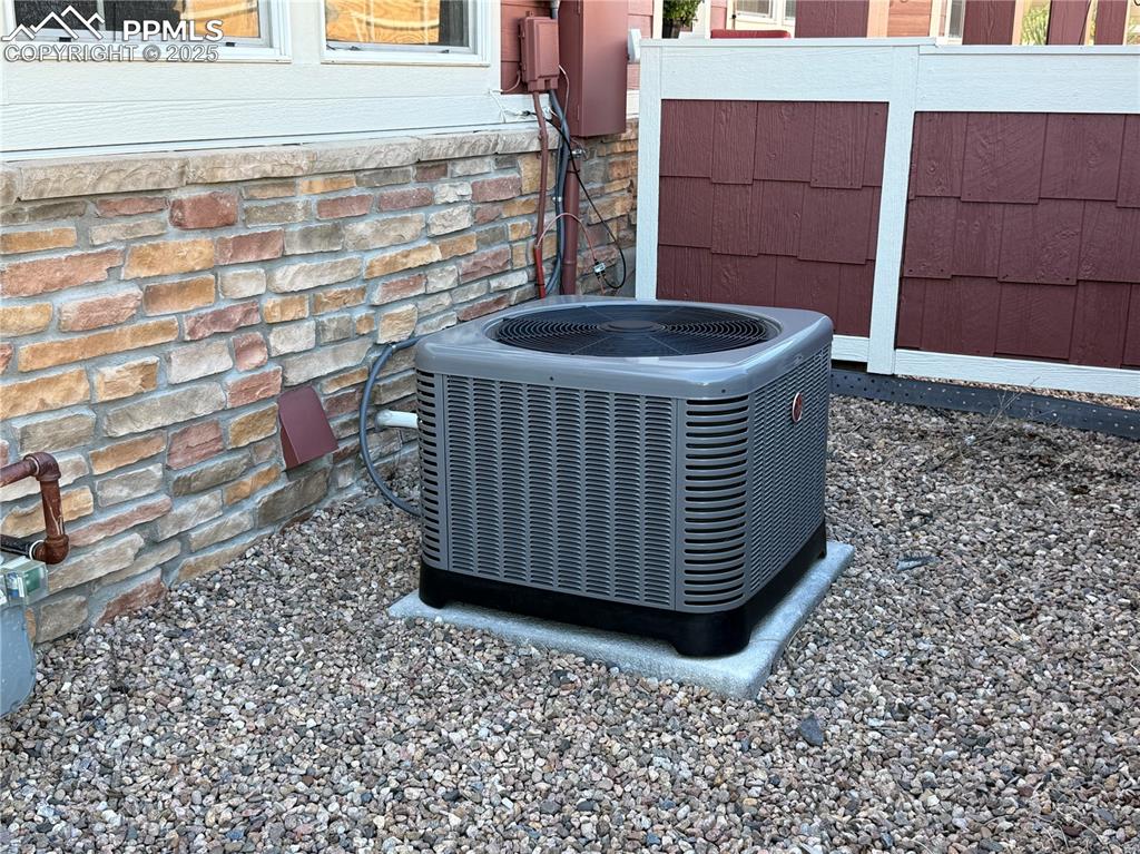 Image 26 of 32: Exterior view of a central air condition unit