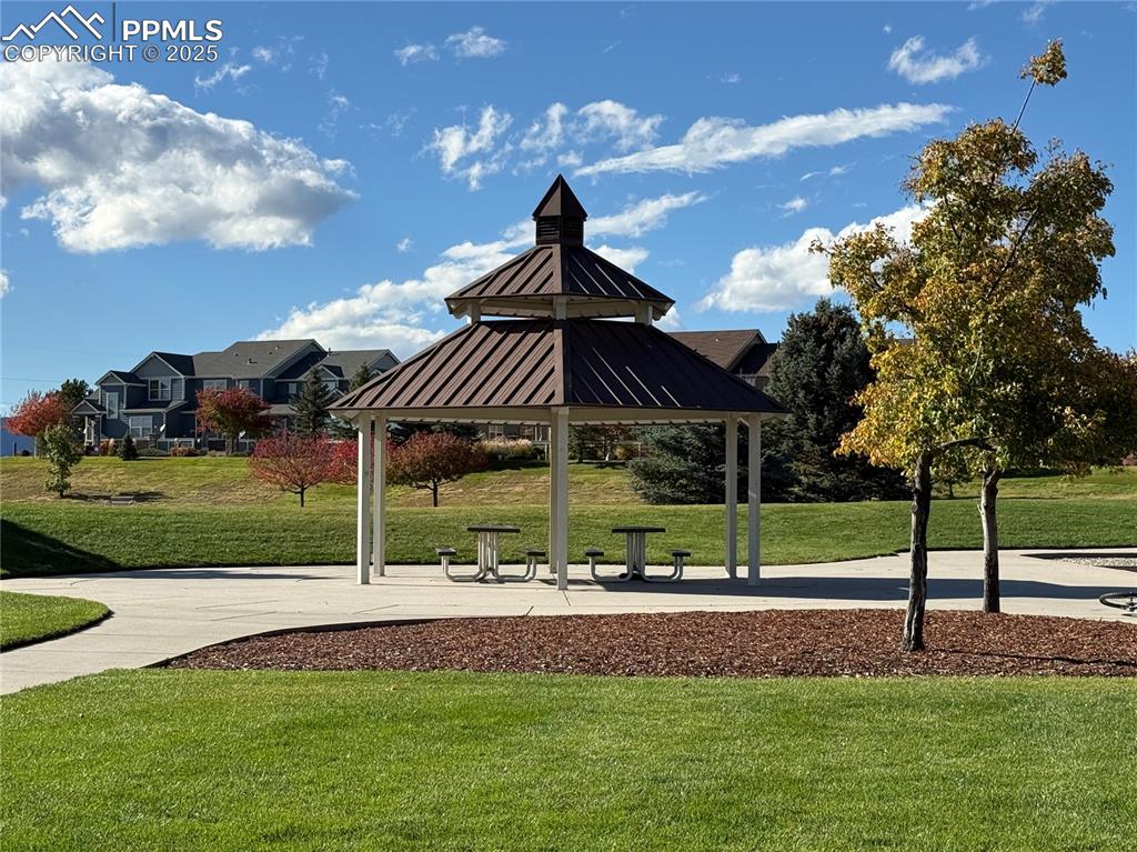Image 31 of 32: Surrounding community featuring a lawn, a gazebo, and a patio area