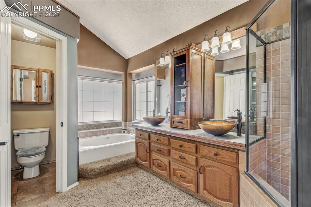 Image 14 of 35: 5-piece bathroom connected to the master bedroom.