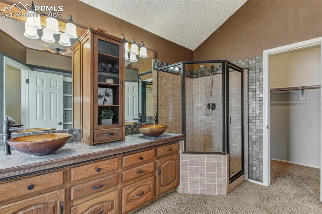 Image 15 of 35: Spacious walk-in shower and large walk-in closet.