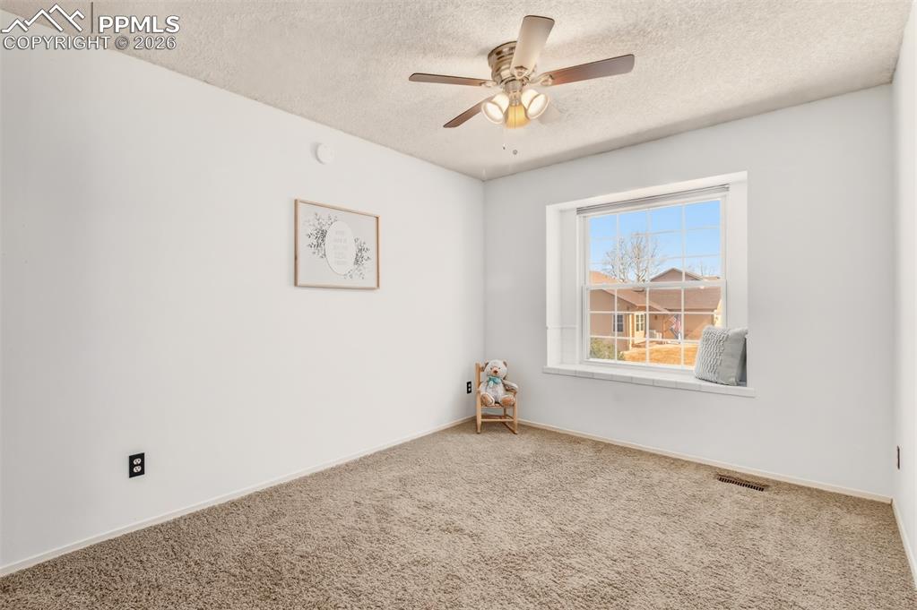 Image 16 of 35: Bedroom #2 with a window seat. 