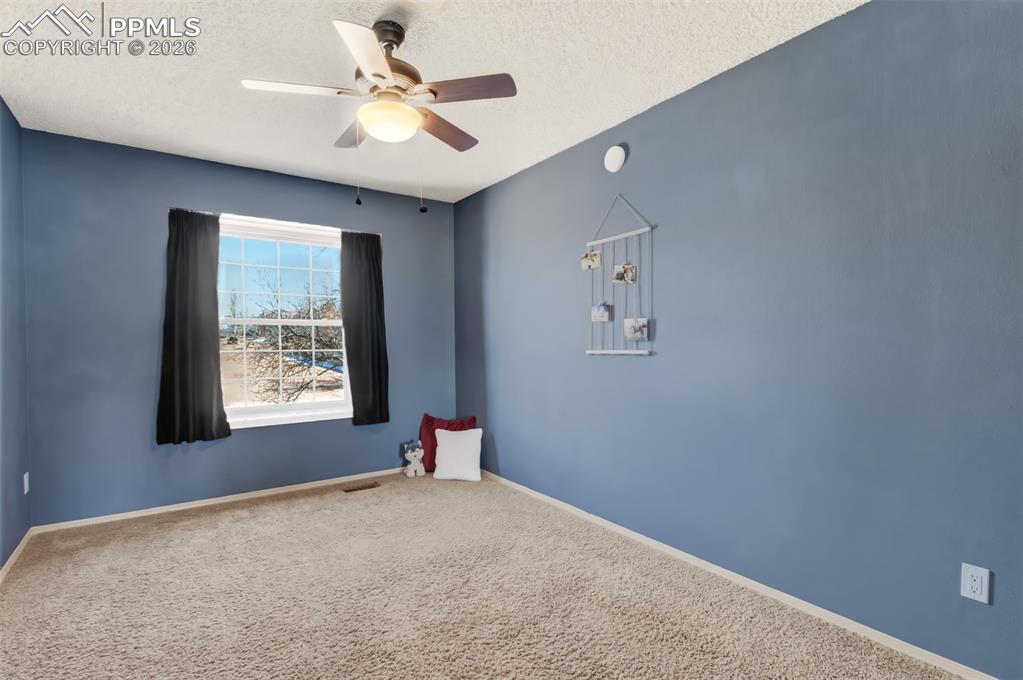 Image 18 of 35: Bedroom #3 with vaulted ceilings and a window seat. 