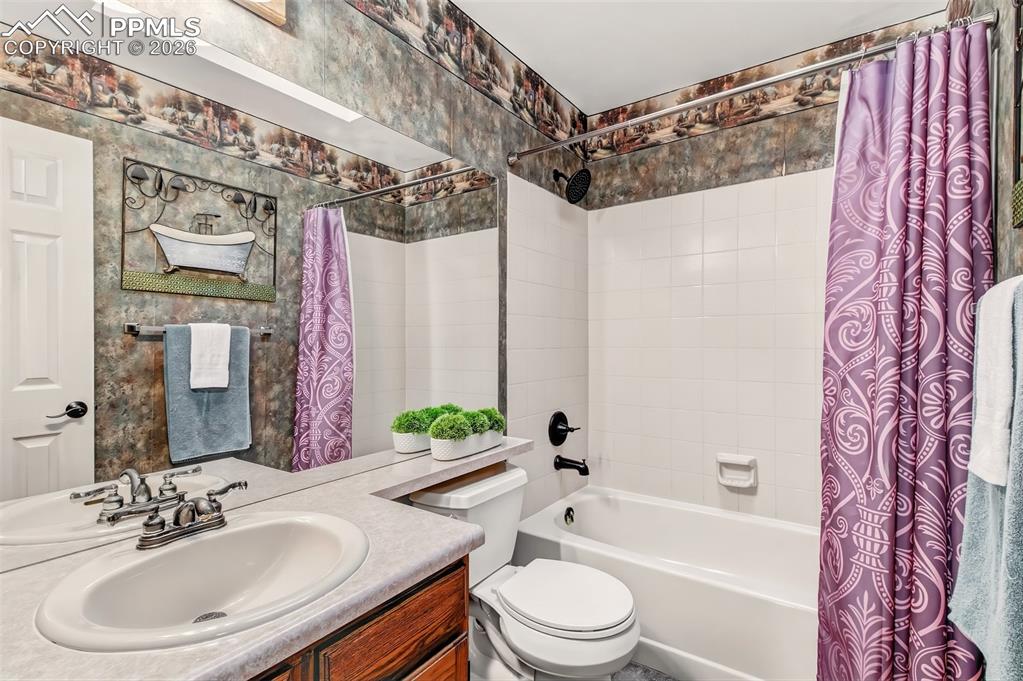 Image 20 of 35: Upstairs full bathroom. 