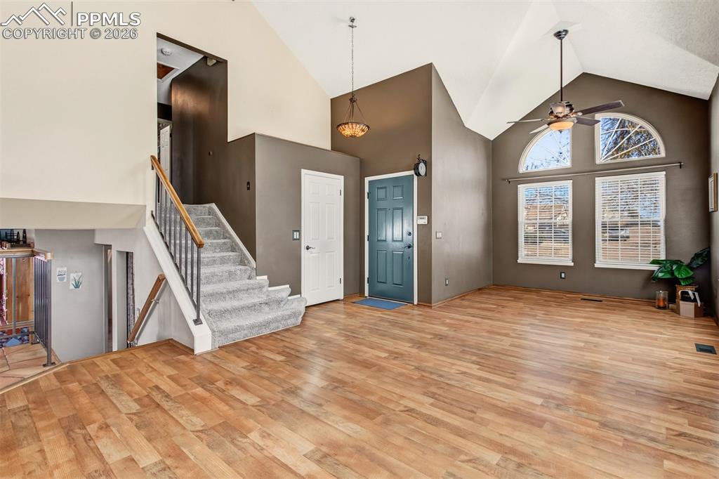 Image 3 of 35: Step through the front door into a bright and welcoming living room featuri